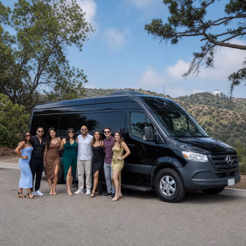 Group beside a Mercedes Sprinter limo from the Los Angeles fleet