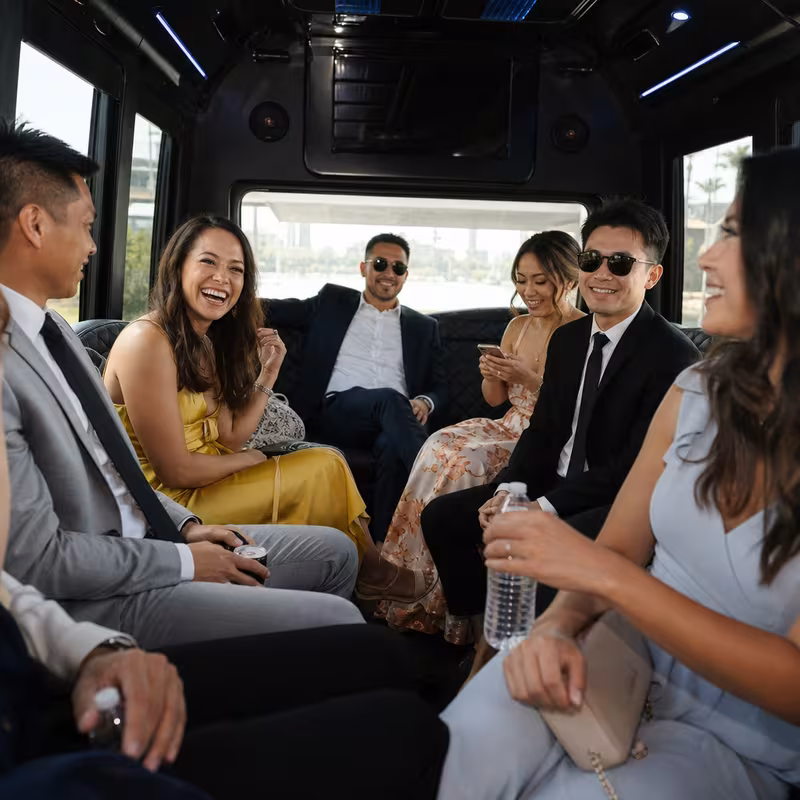 Wedding guests seated inside a Los Angeles party bus
