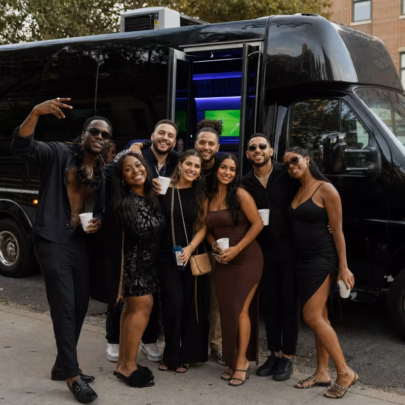 Party bus interior with wraparound leather seating and LED lighting in Los Angeles