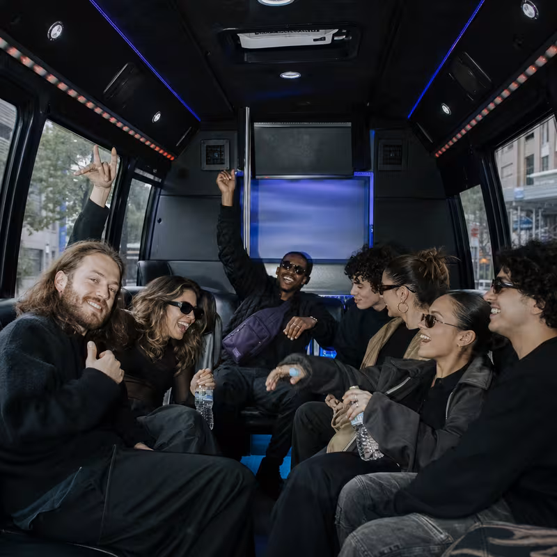 Passengers loading luggage while boarding an Los Angeles group shuttle