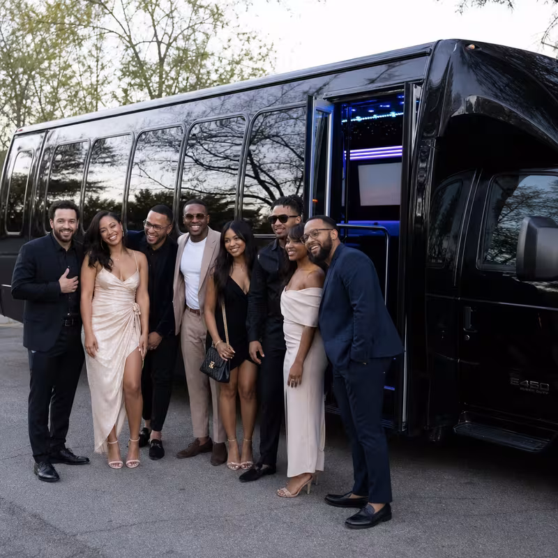 Passengers loading luggage while boarding an Los Angeles group shuttle
