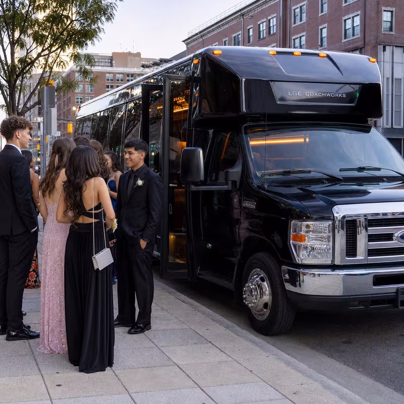 Passengers loading luggage while boarding an Los Angeles group shuttle