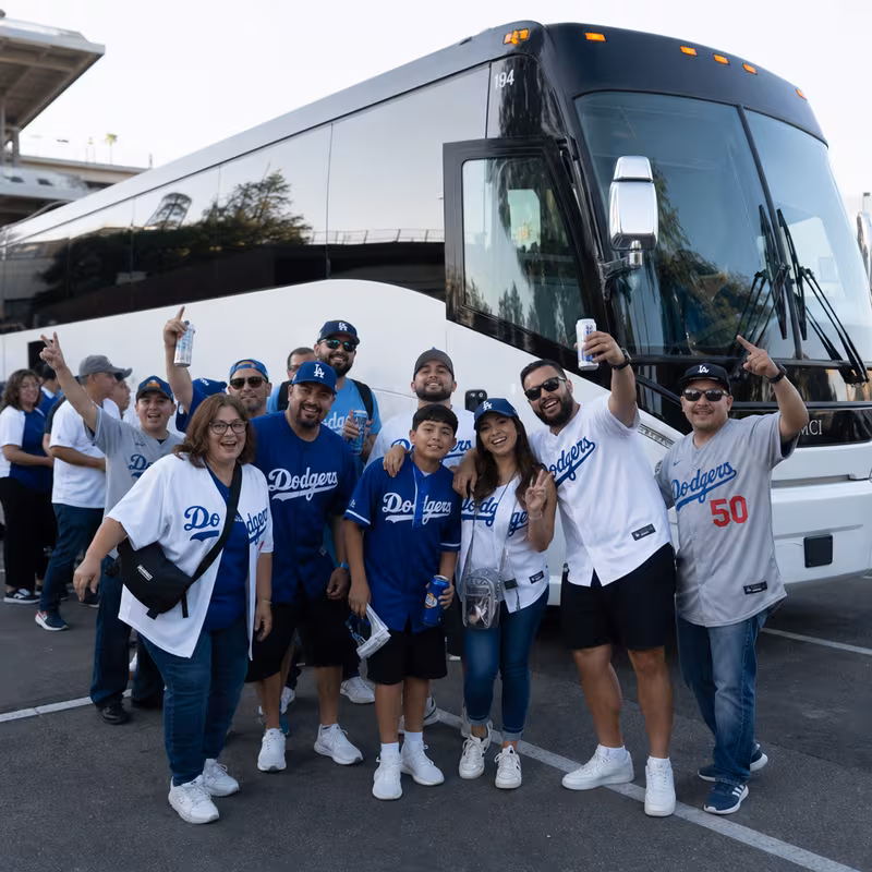 Passengers loading luggage while boarding an Los Angeles group shuttle