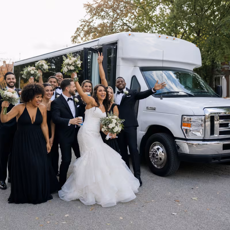 Passengers loading luggage while boarding an Los Angeles group shuttle
