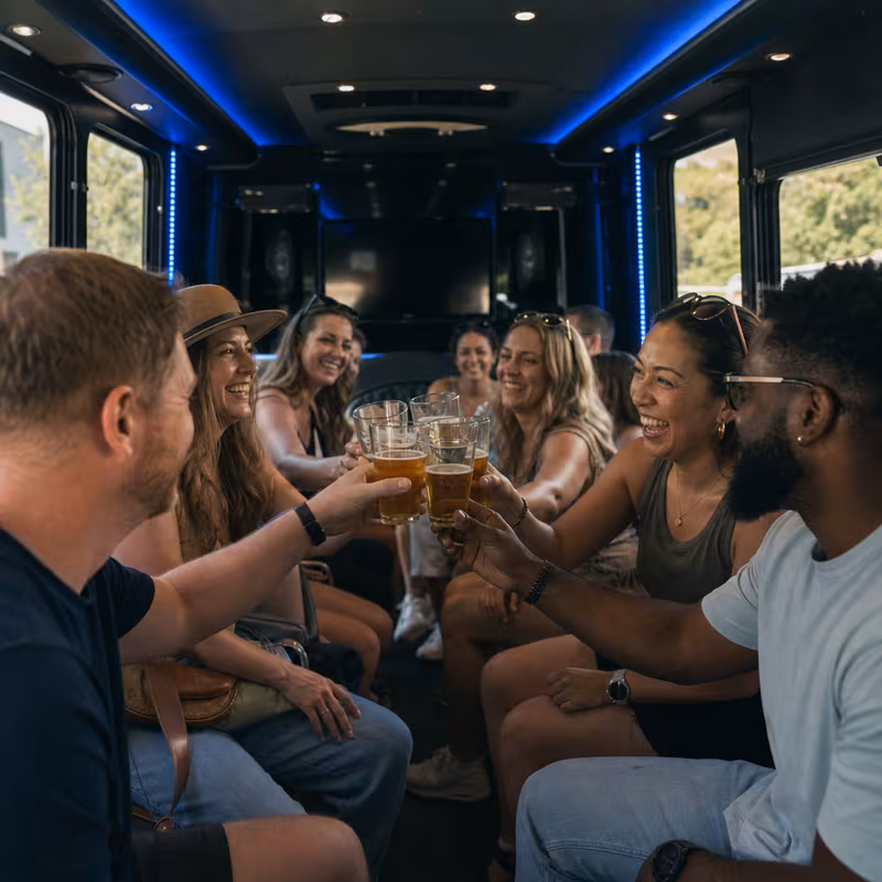 Group boarding a white charter bus for Winery & Brewery Tour Transportation transportation in Los Angeles